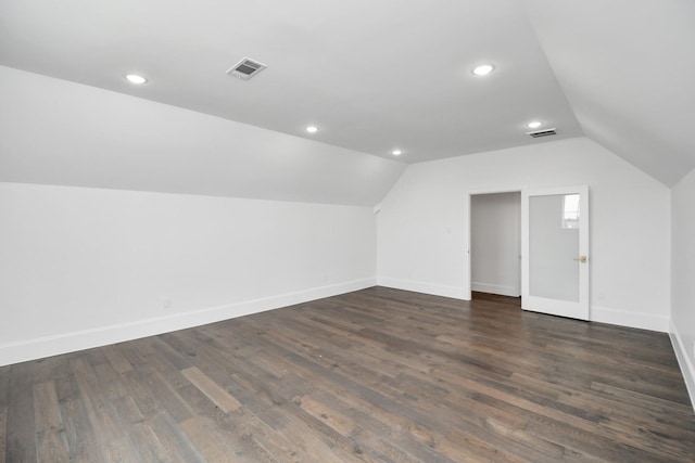 7153 Fm 1458th Rd, Sealy, TX 77474 - bonus room with lofted ceiling, dark wood finished floors, baseboards, and recessed lighting