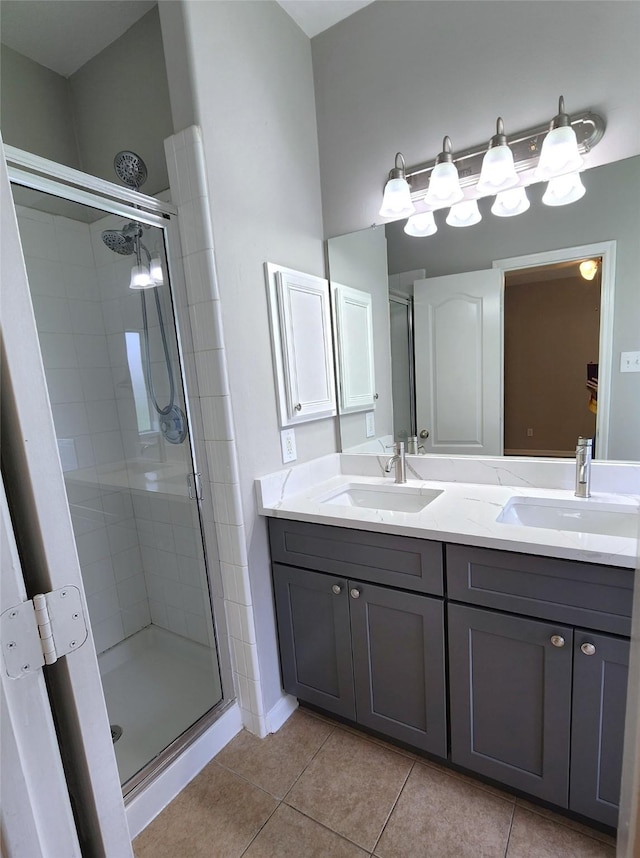 2623 Sable Ridge Ln, Katy, TX 77494 - bathroom with a stall shower, double vanity, and tile patterned floors
