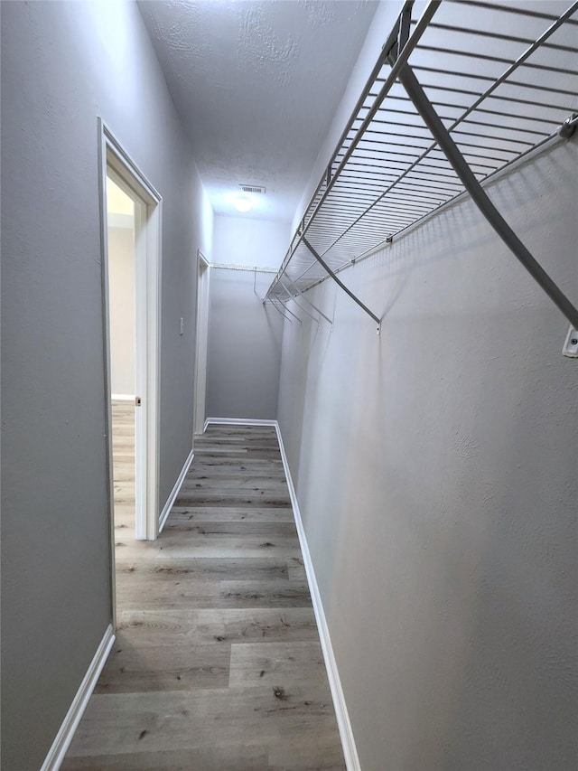 2623 Sable Ridge Ln, Katy, TX 77494 - spacious closet featuring wood finished floors
