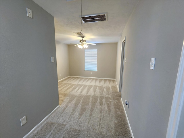 2623 Sable Ridge Ln, Katy, TX 77494 - spare room featuring baseboards, light colored carpet, attic access, and ceiling fan