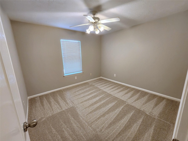 2623 Sable Ridge Ln, Katy, TX 77494 - spare room with carpet floors, a ceiling fan, and baseboards
