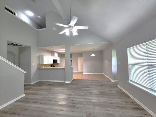 2623 Sable Ridge Ln, Katy, TX 77494 - unfurnished living room featuring lofted ceiling, ceiling fan, and light wood finished floors