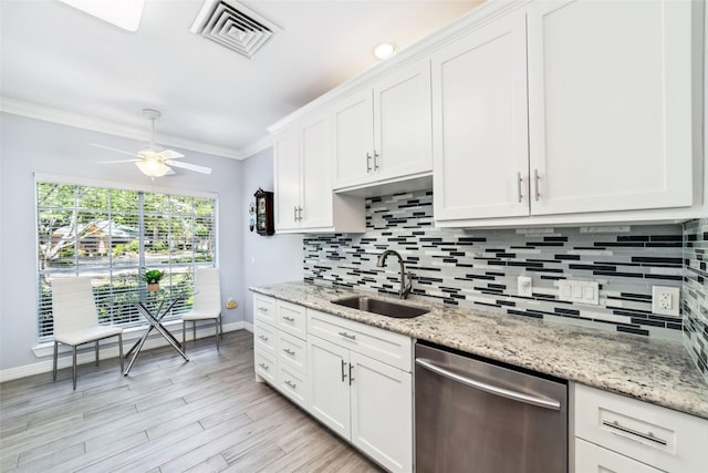 2815 Kings Crossing Dr Unit 106, Houston, TX 77345 - kitchen featuring stainless steel dishwasher, a sink, baseboards, decorative backsplash, and crown molding