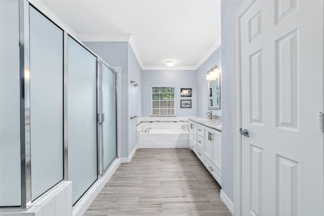 2815 Kings Crossing Dr Unit 106, Houston, TX 77345 - full bathroom with crown molding, vanity, a shower stall, a bath, and wood finished floors