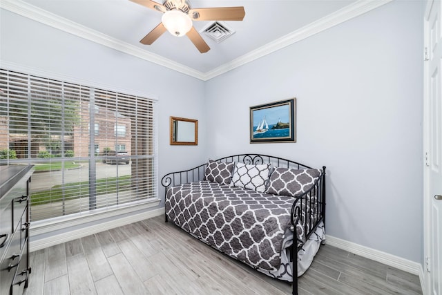 2815 Kings Crossing Dr Unit 106, Houston, TX 77345 - bedroom featuring baseboards, wood finished floors, ornamental molding, and ceiling fan