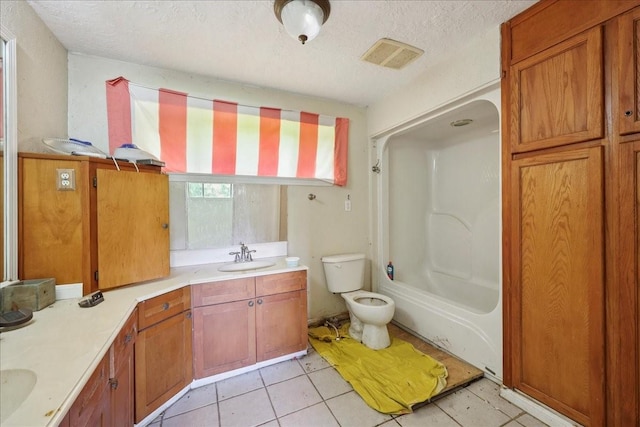 2630 35th St, Pinehurst, TX 77630 - bathroom featuring toilet, a textured ceiling, vanity, tile patterned flooring, and shower / bathtub combination