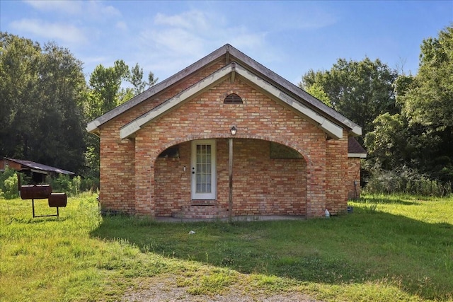 2630 35th St, Pinehurst, TX 77630 - view of property exterior with brick siding and a lawn