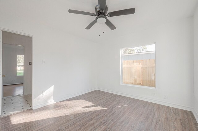 607 Speed St, Wharton, TX 77488 - empty room featuring wood finished floors, baseboards, and a ceiling fan