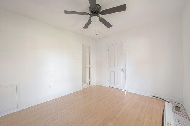 607 Speed St, Wharton, TX 77488 - unfurnished room with attic access, ceiling fan, light wood-type flooring, and baseboards