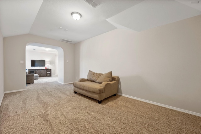 2978 Vintage Park Ln, Pearland, TX 77584 - sitting room with carpet flooring, lofted ceiling, arched walkways, and baseboards
