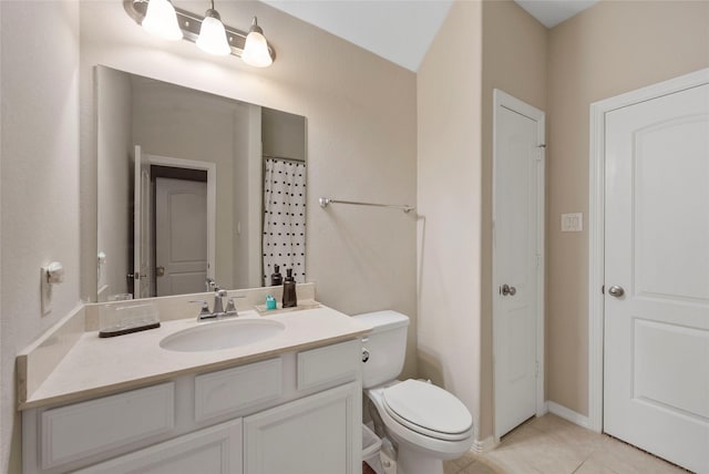 2978 Vintage Park Ln, Pearland, TX 77584 - bathroom with vanity, toilet, tile patterned floors, and baseboards