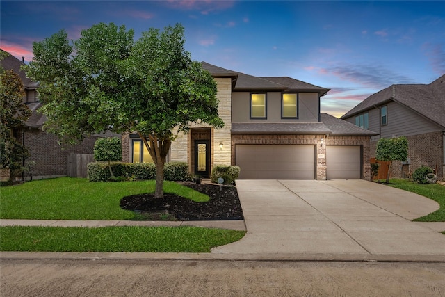2978 Vintage Park Ln, Pearland, TX 77584 - view of front of house featuring driveway, a yard, stone siding, an attached garage, and a shingled roof