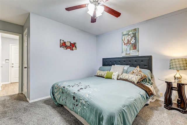 14203 Coveney Dr, Houston, TX 77090 - carpeted bedroom with baseboards and ceiling fan