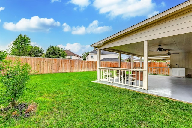 14203 Coveney Dr, Houston, TX 77090 - view of yard featuring a patio area, ceiling fan, and a sink