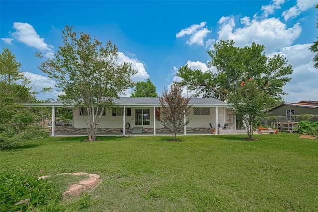 220 Palmyra St, Houston, TX 77022 - rear view of property featuring a lawn and a patio area