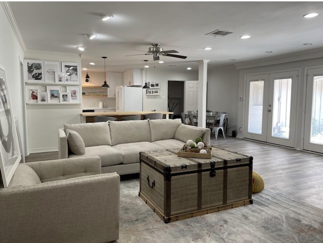 5474 Imogene St, Houston, TX 77096 - living room with a ceiling fan, ornamental molding, recessed lighting, light wood-style flooring, and french doors