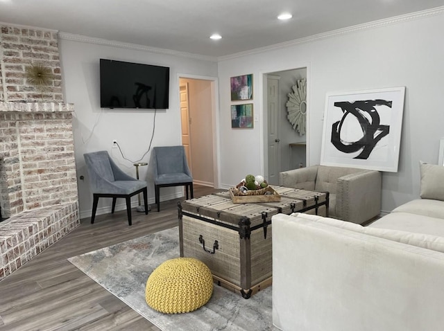 5474 Imogene St, Houston, TX 77096 - living area with wood finished floors, ornamental molding, recessed lighting, and baseboards