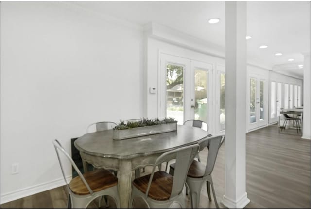 5474 Imogene St, Houston, TX 77096 - dining space with wood finished floors, plenty of natural light, recessed lighting, baseboards, and ornamental molding