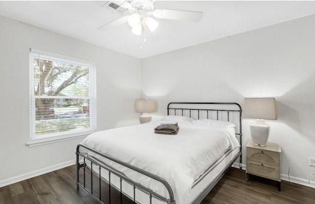 5474 Imogene St, Houston, TX 77096 - bedroom featuring multiple windows, baseboards, and wood finished floors