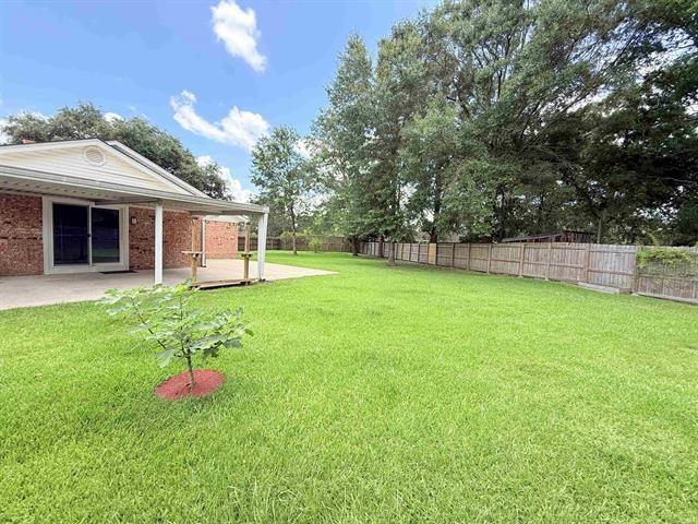 9410 Guy Cir, Beaumont, TX 77707 - view of yard with a patio area