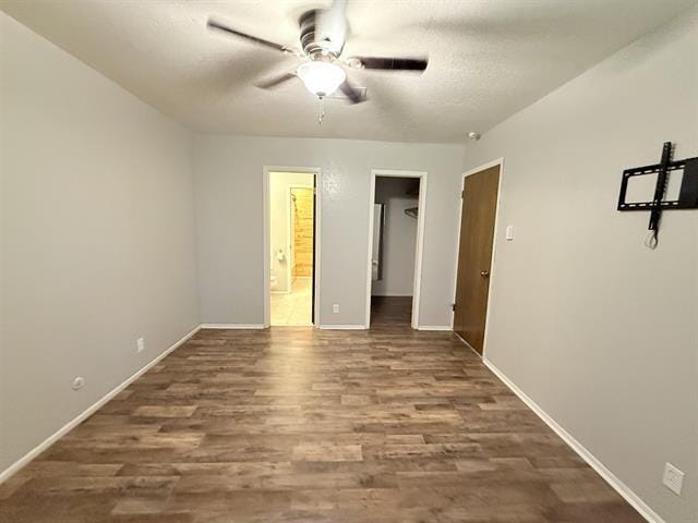 9410 Guy Cir, Beaumont, TX 77707 - unfurnished room with a ceiling fan, wood finished floors, and baseboards