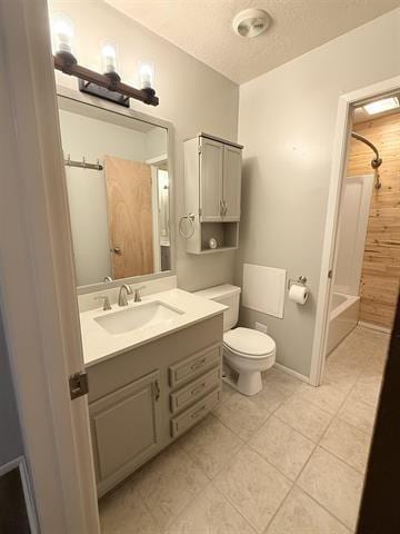 9410 Guy Cir, Beaumont, TX 77707 - full bathroom with vanity, toilet, tile patterned flooring, a textured ceiling, and  shower combination