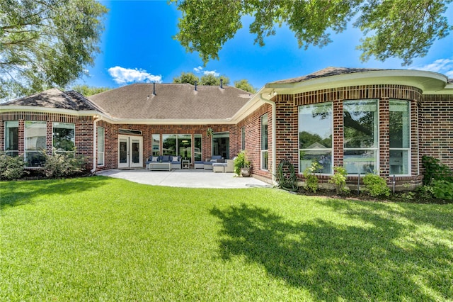 6219 Mound Airy Ct, Sugar Land, TX 77479 - back of house with an outdoor hangout area, french doors, a patio, a lawn, and brick siding
