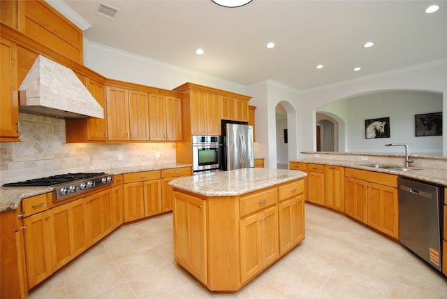 504 High Meadow Ranch Dr, Magnolia, TX 77355 - kitchen featuring appliances with stainless steel finishes, custom exhaust hood, ornamental molding, light tile patterned floors, and a kitchen island