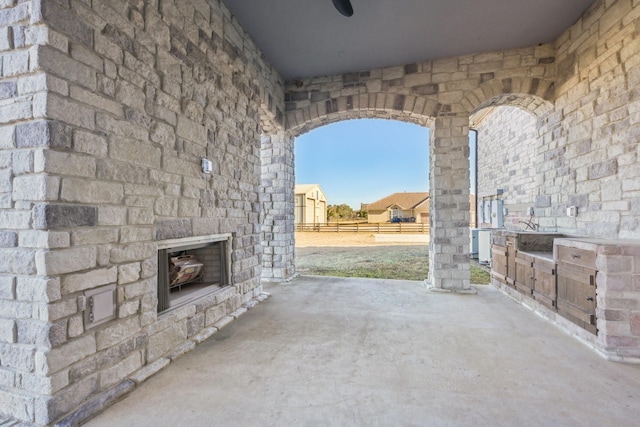 504 High Meadow Ranch Dr, Magnolia, TX 77355 - view of patio / terrace with an outdoor fireplace