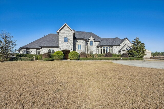 504 High Meadow Ranch Dr, Magnolia, TX 77355 - french country home featuring stone siding
