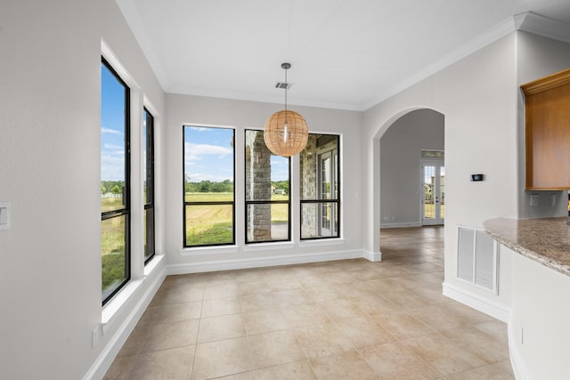 504 High Meadow Ranch Dr, Magnolia, TX 77355 - unfurnished dining area featuring arched walkways, crown molding, and light tile patterned floors