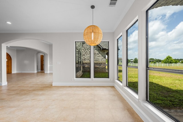 504 High Meadow Ranch Dr, Magnolia, TX 77355 - unfurnished dining area featuring arched walkways, ornamental molding, light tile patterned floors, and recessed lighting