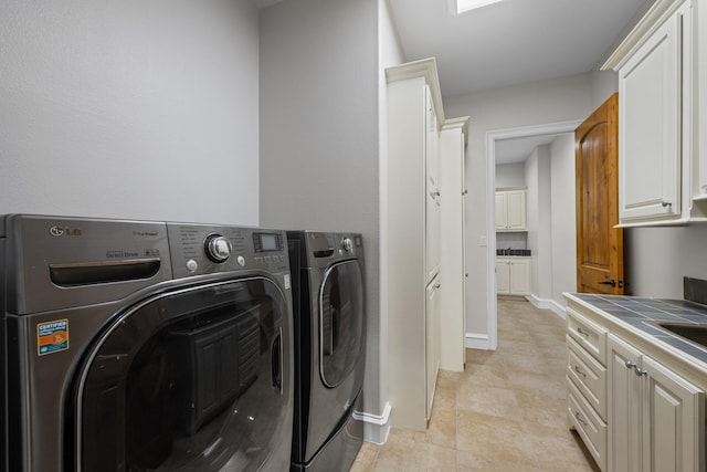 504 High Meadow Ranch Dr, Magnolia, TX 77355 - laundry area featuring independent washer and dryer and cabinet space