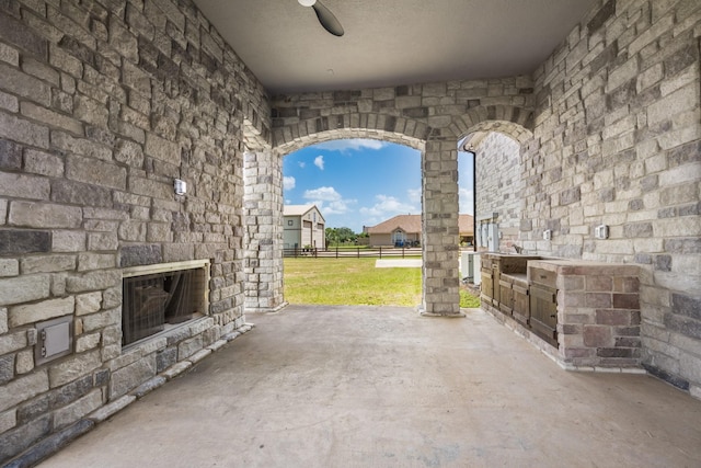504 High Meadow Ranch Dr, Magnolia, TX 77355 - view of patio with an outdoor stone fireplace and ceiling fan