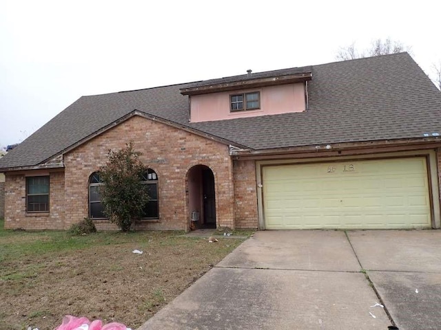 6618 Trigate Dr, Houston, TX 77489 - view of front of home with a shingled roof, concrete driveway, brick siding, and a garage