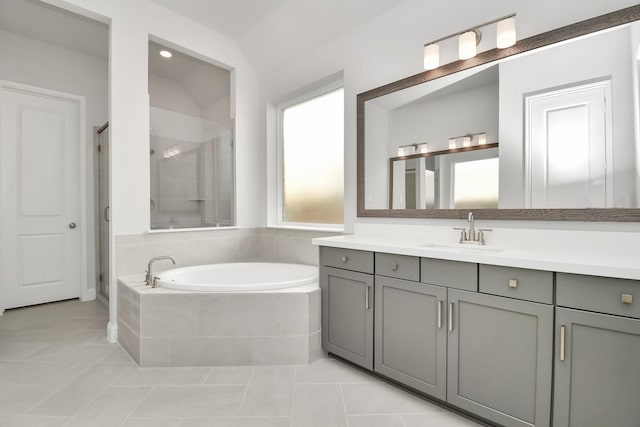 20922 Whirlaway Green Cir, Tomball, TX 77377 - full bathroom with vanity, a garden tub, a shower stall, and tile patterned flooring