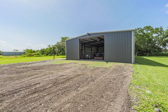 4222 Skylane Rd, Beach City, TX 77523 - view of pole building featuring a lawn and dirt driveway