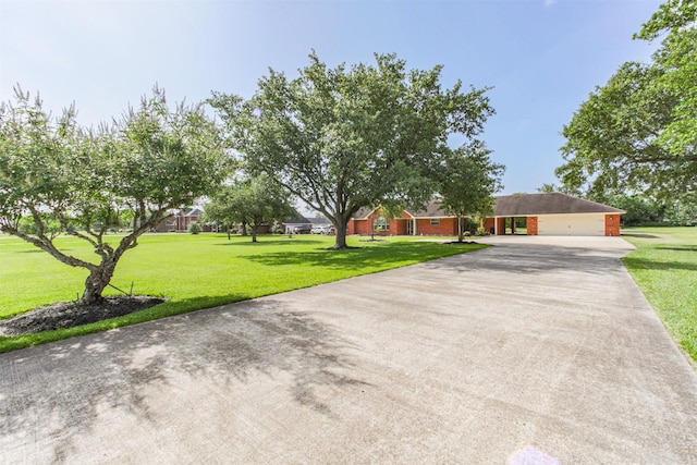 4222 Skylane Rd, Beach City, TX 77523 - view of front of home with driveway and a front lawn