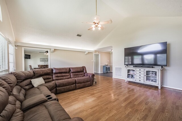 4222 Skylane Rd, Beach City, TX 77523 - living room featuring ceiling fan, high vaulted ceiling, wood finished floors, and baseboards
