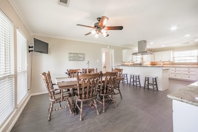 4222 Skylane Rd, Beach City, TX 77523 - dining room featuring a ceiling fan, ornamental molding, dark wood-style floors, recessed lighting, and baseboards