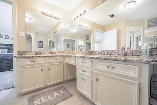 4222 Skylane Rd, Beach City, TX 77523 - ensuite bathroom with double vanity and tile patterned floors