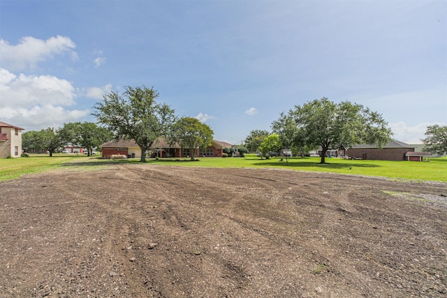 4222 Skylane Rd, Beach City, TX 77523 - view of green lawn featuring dirt driveway