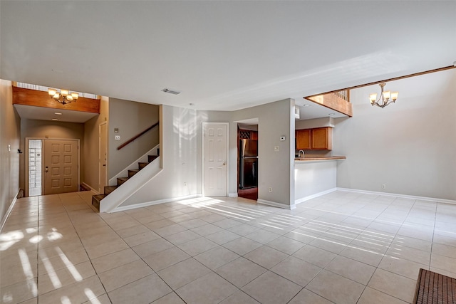 2011 Converse St, Houston, TX 77006 - unfurnished living room featuring a chandelier, light tile patterned flooring, and stairway
