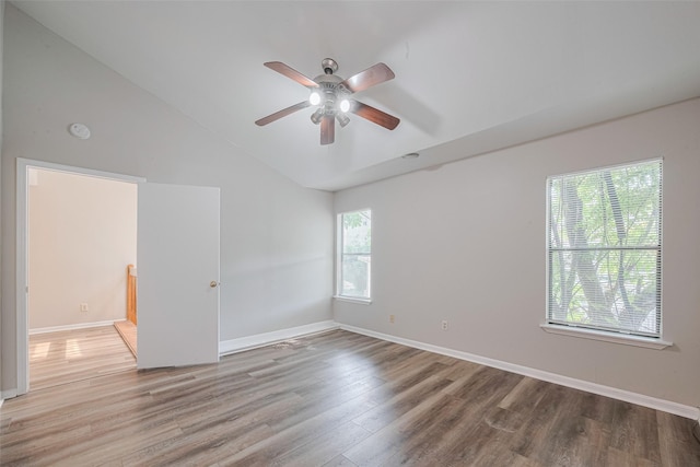 2011 Converse St, Houston, TX 77006 - unfurnished room with wood finished floors, a ceiling fan, vaulted ceiling, baseboards, and a smoke detector