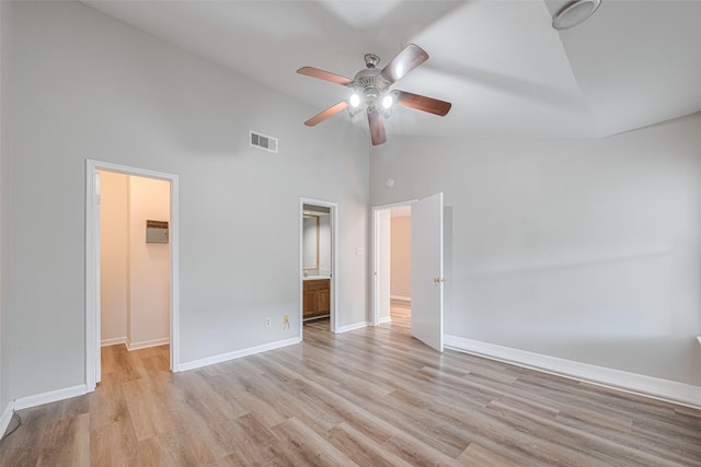 2011 Converse St, Houston, TX 77006 - unfurnished bedroom with high vaulted ceiling, a walk in closet, light wood-style floors, baseboards, and ceiling fan