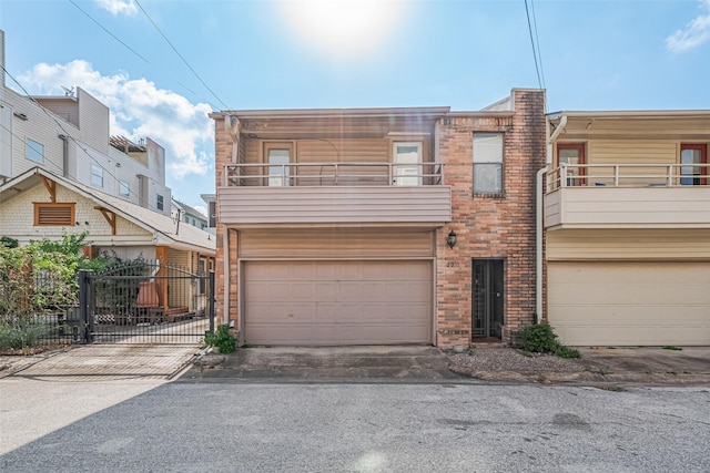 2011 Converse St, Houston, TX 77006 - view of front of property with a balcony, a garage, and driveway
