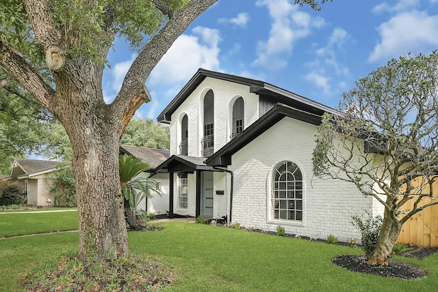 5702 Indigo St, Houston, TX 77096 - view of front facade featuring brick siding and a front lawn
