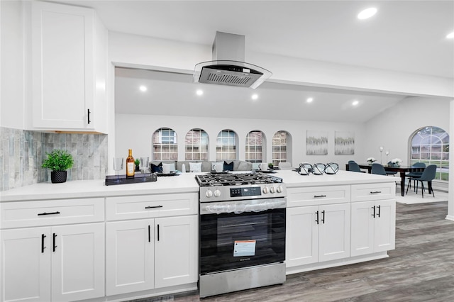 5702 Indigo St, Houston, TX 77096 - kitchen with gas stove, island exhaust hood, light wood-type flooring, backsplash, and white cabinetry