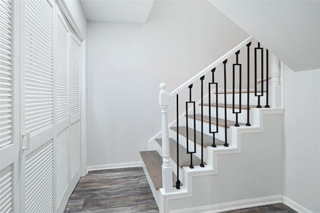 5702 Indigo St, Houston, TX 77096 - stairway featuring wood finished floors and baseboards