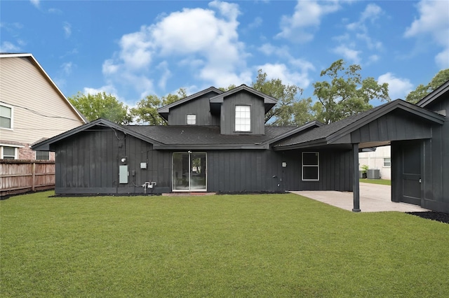5702 Indigo St, Houston, TX 77096 - rear view of house with a patio, roof with shingles, a carport, and board and batten siding